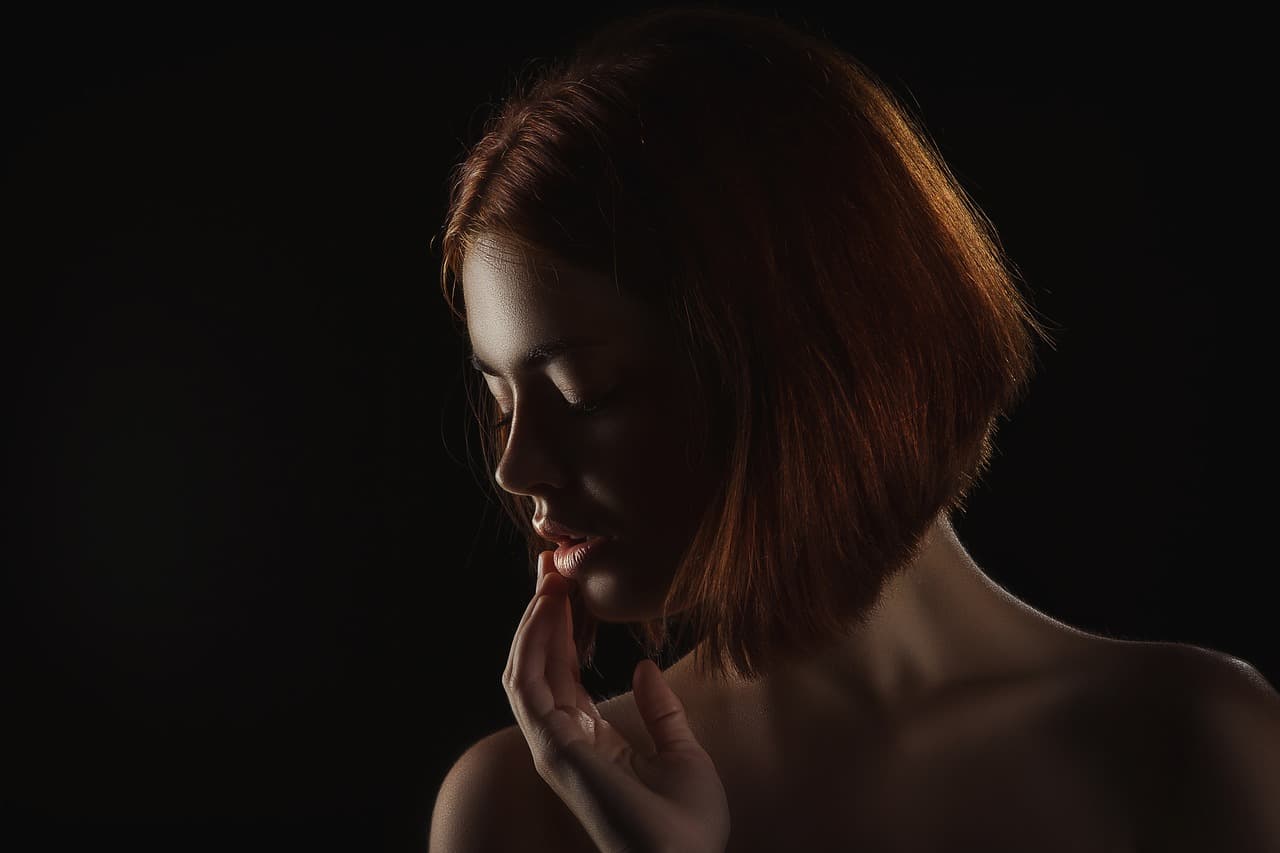 Woman with a sleek copper bob