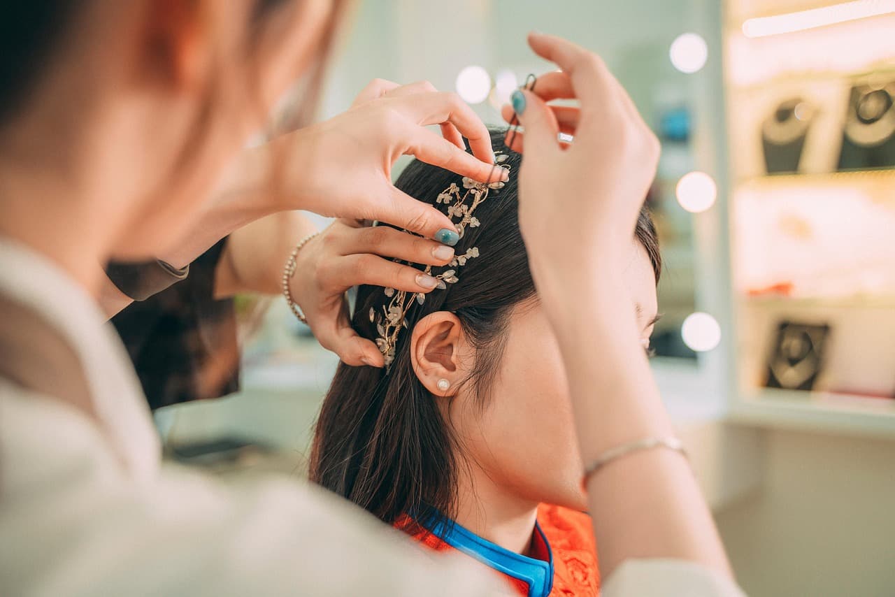 Stylist pinning up long dark hair